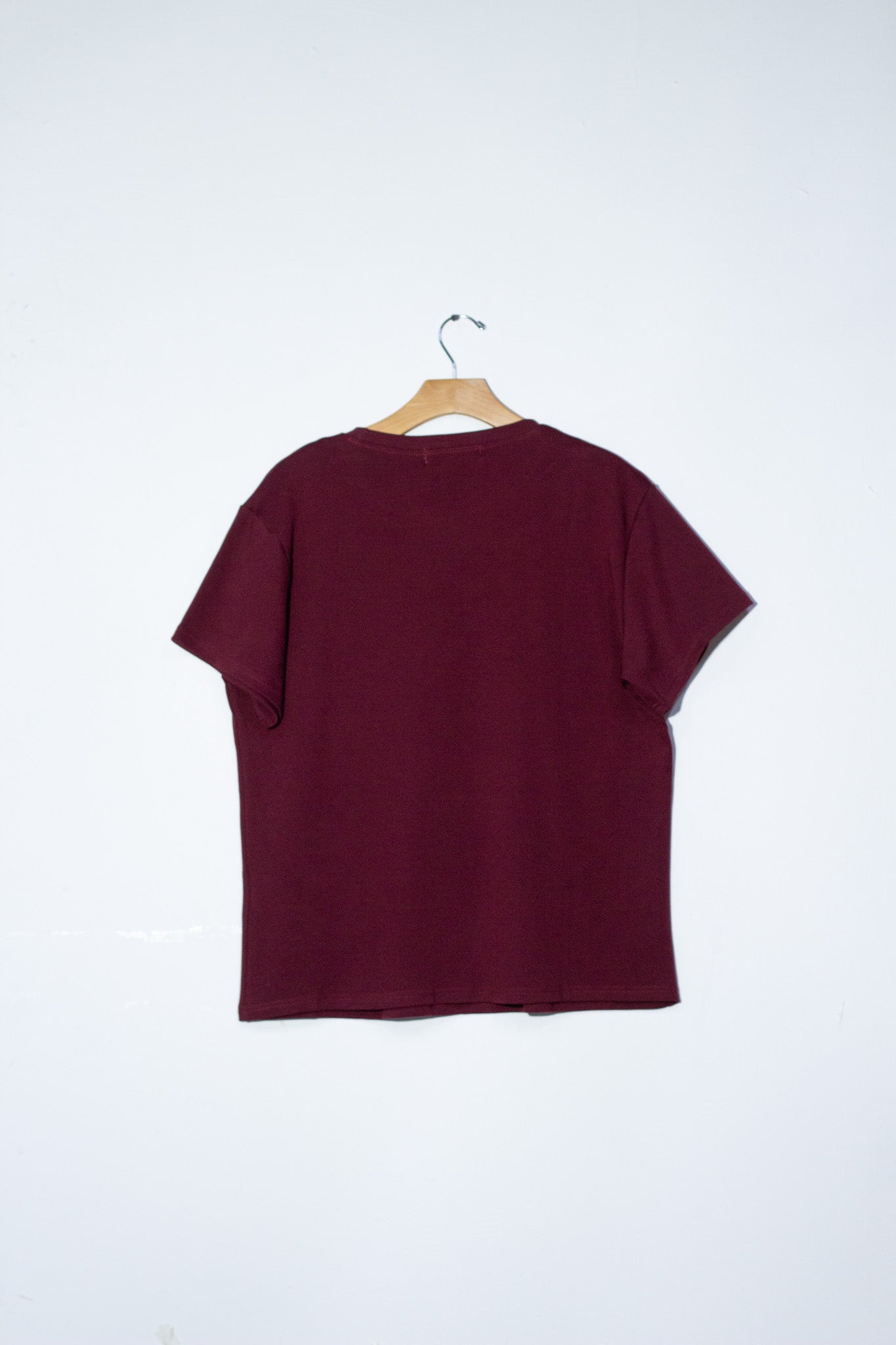 Blusa detalles moños y perlas