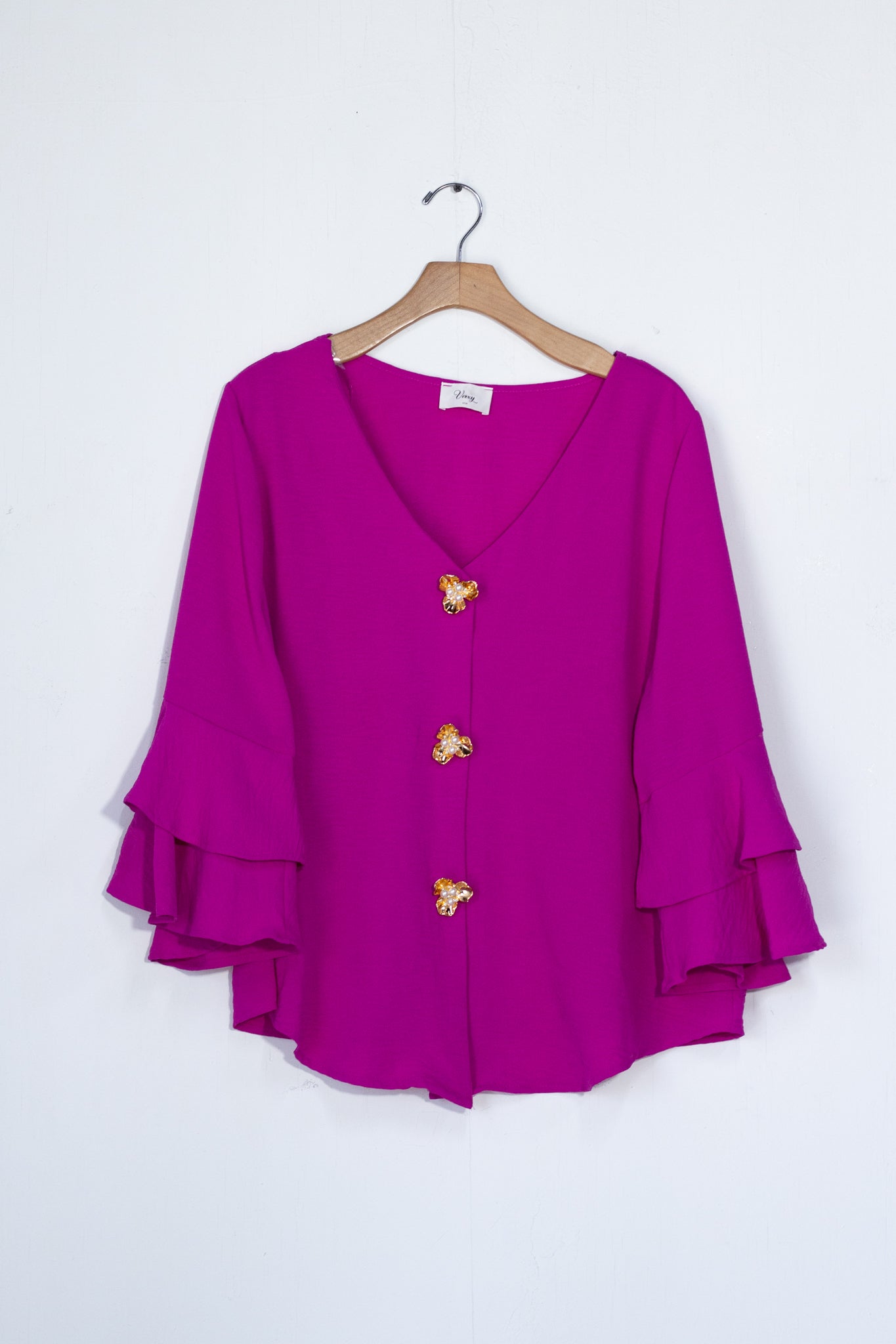 Blusa lisa botones flor