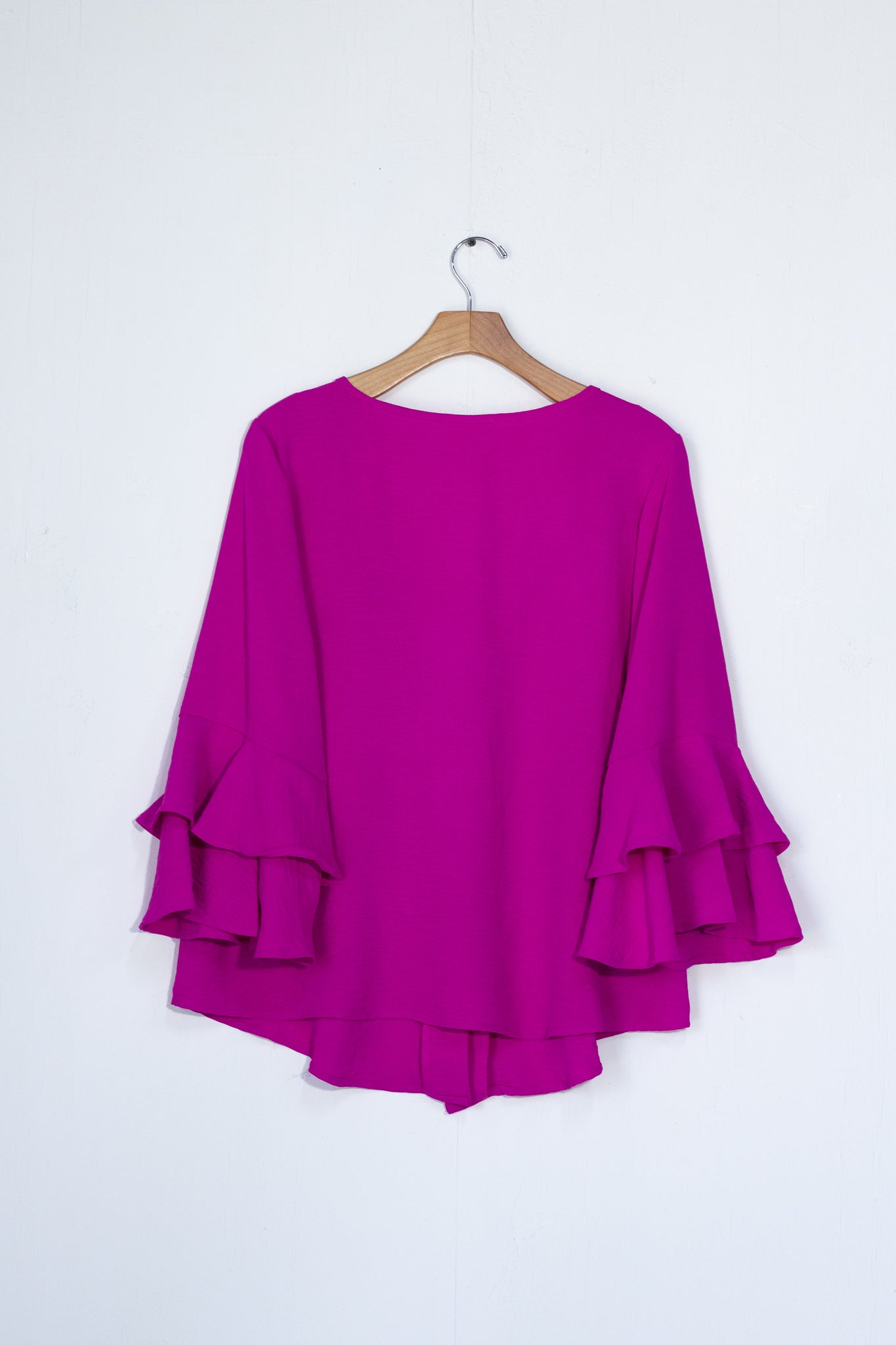 Blusa lisa botones flor