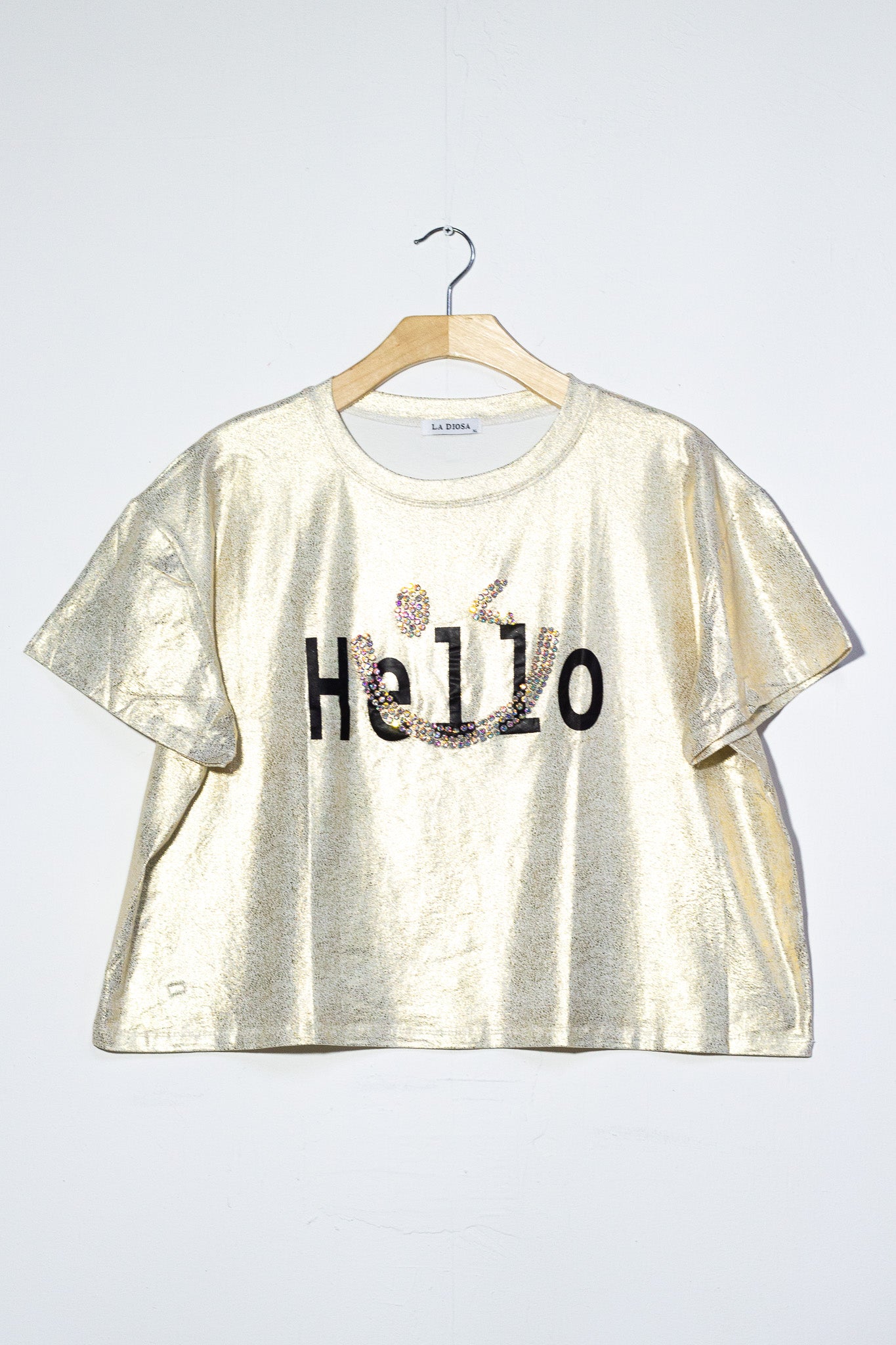 Blusa metalica hello dorada