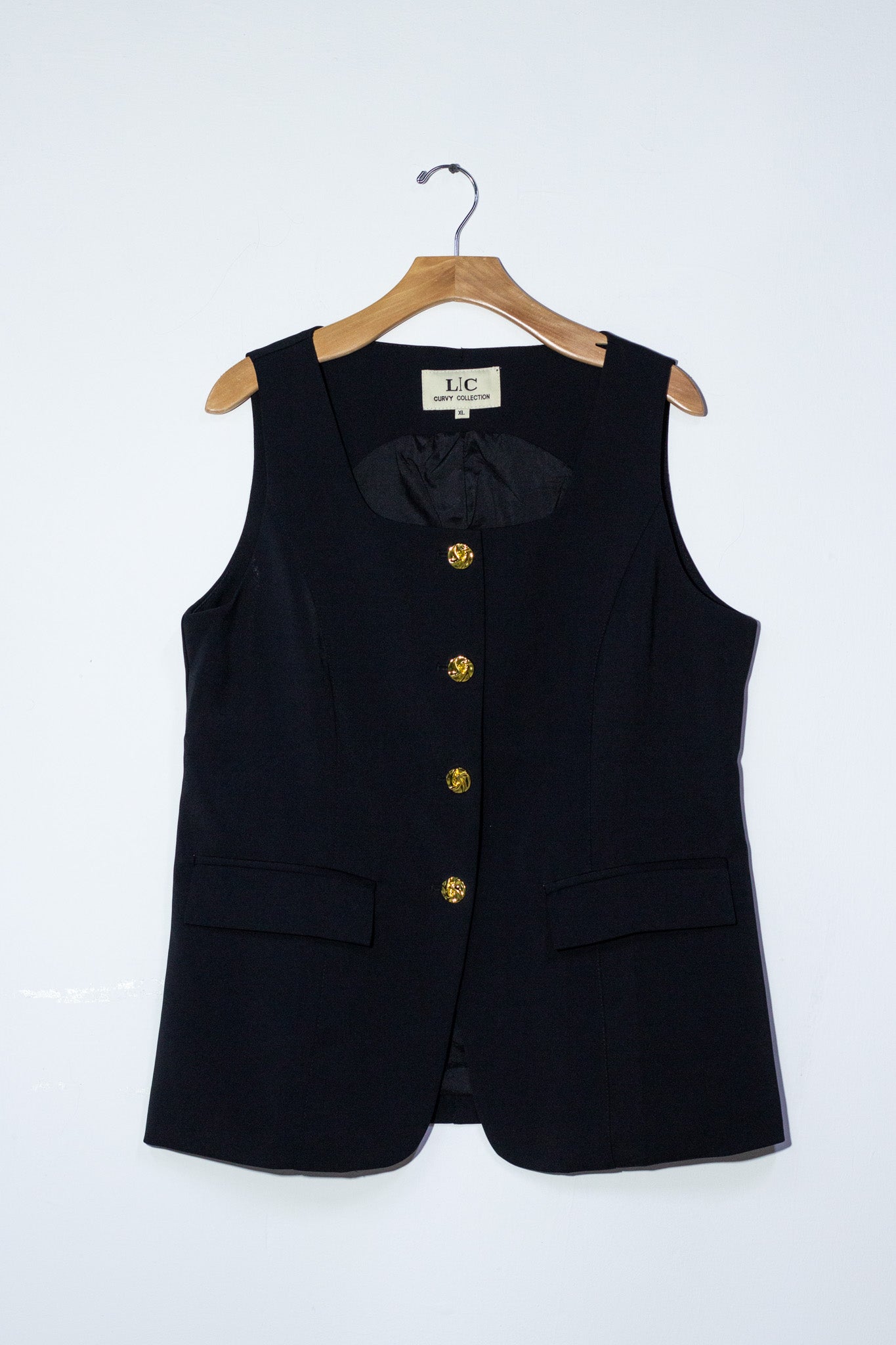 Chaleco liso con botones neg