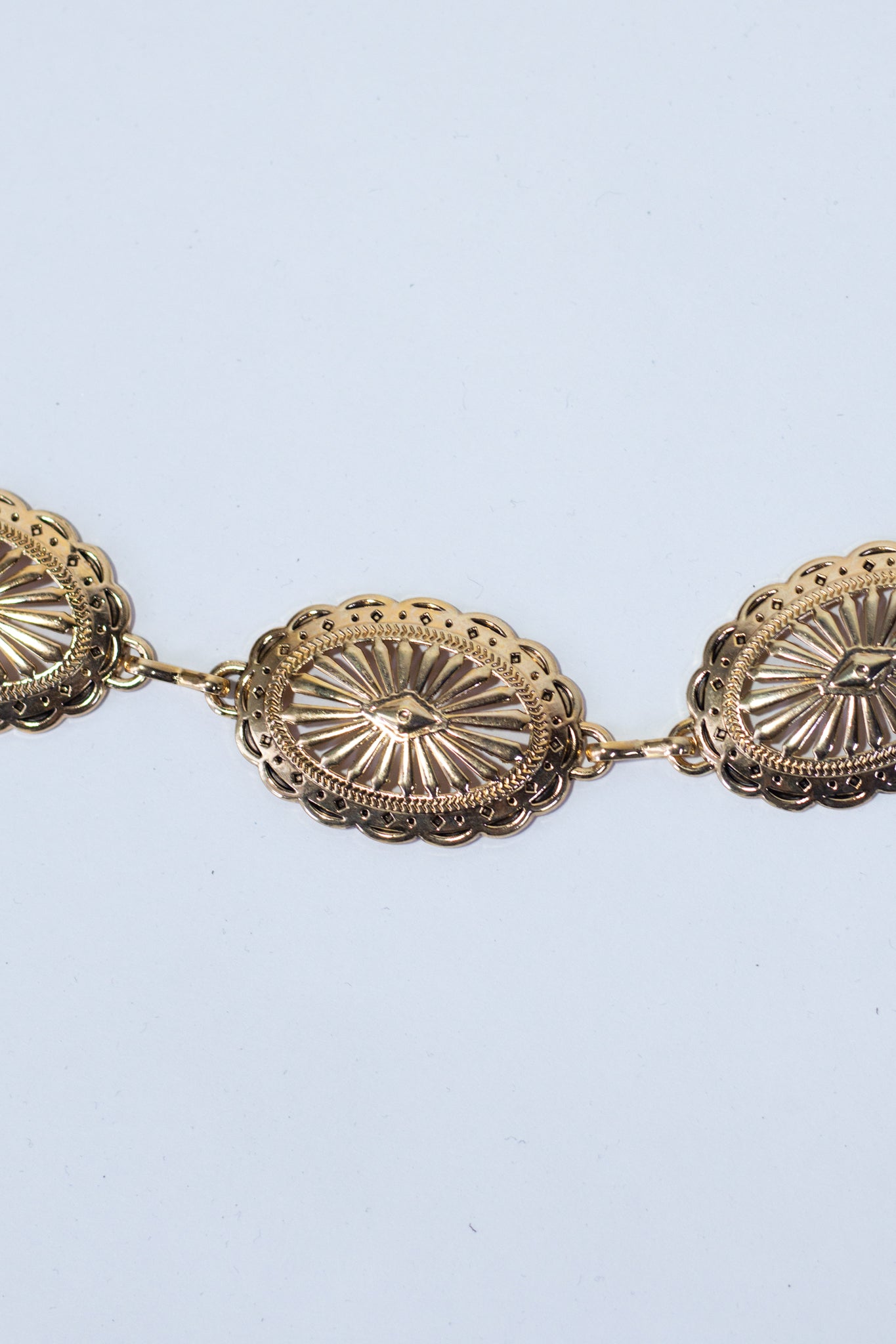 Cinto cadena medallas doradas