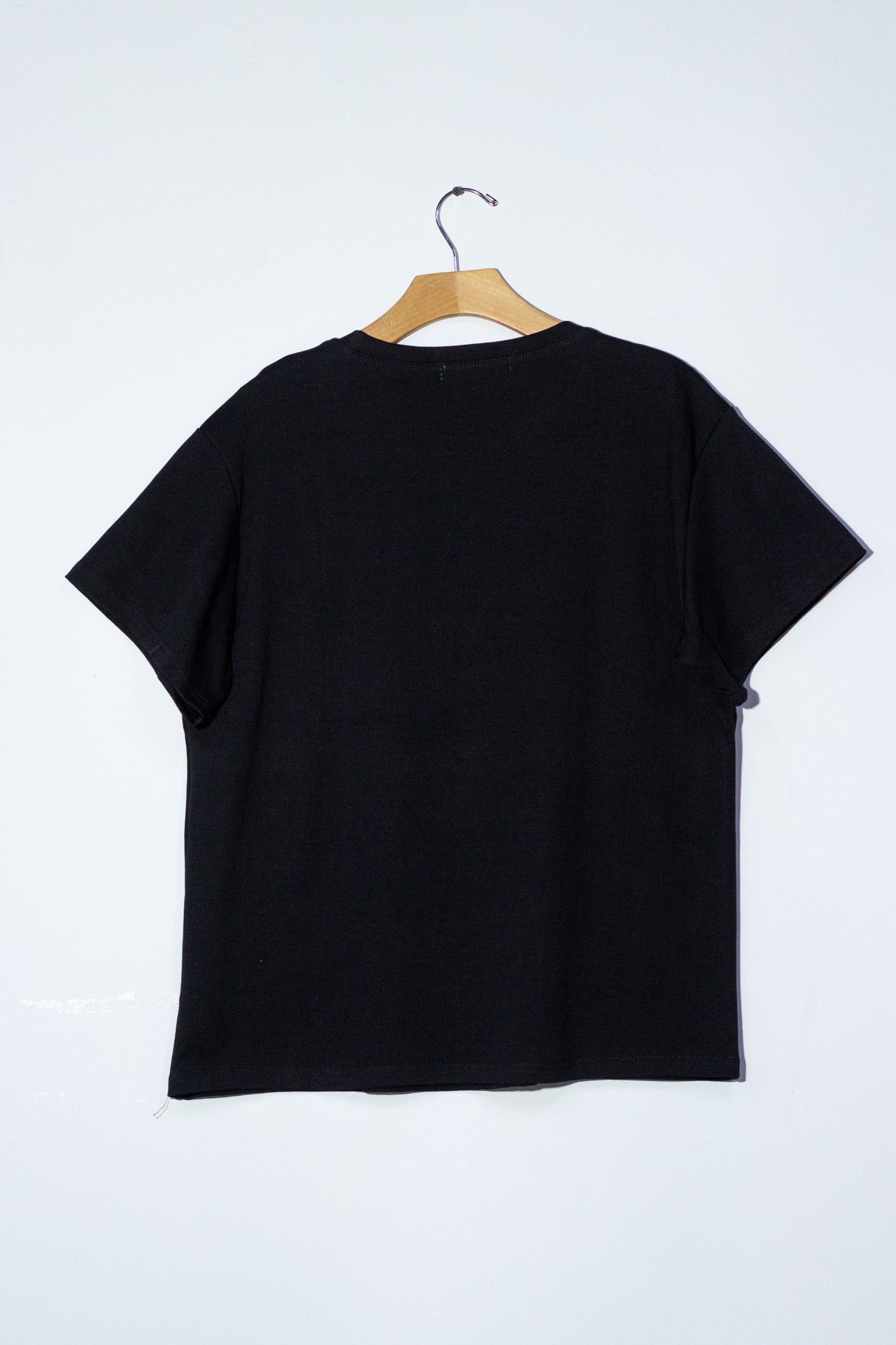 Blusa detalles moños y perlas